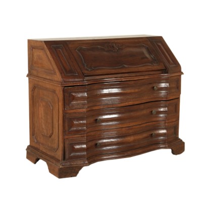 The chest of drawers to the fore in walnut