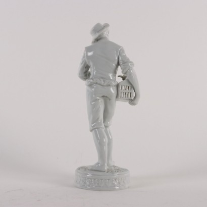 Figura de porcelana Hombre joven con jaula