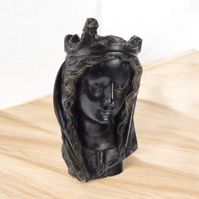 Female Face in Bronze