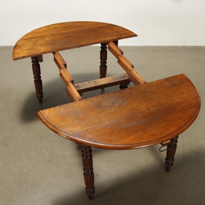 Extendable walnut table with hinges