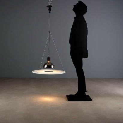 'Frisbi 850' lamp by,Achille Castiglioni,Achille Castiglioni (1918–2002) was the only Italian architect and designer to whom the MoMA in New York has dedicated a retrospective so far. He completed his studies at the Politecnico di Milano in 1944. A 360-degree designer he was involved in urban planning, architecture, exhibitions, and product design.nIn 1956, he co-founded the Associazione per il Disegno Industriale (ADI – Association for Industrial Design).nBetween 1952 and 1953, he worked on the reconstruction of the Palazzo della Permanente in Milan. From 1955 to 1979, he won seven Compasso d'Oro awards, the last one for the Parentesi lamp designed with Pio Manzù. He was also awarded multiple times at the Triennale: Bronze Medal in 1947, Grand Prize in 1951 and 1954, Silver and Gold Medals in 1957, Gold in 1960, and Silver again in 1963.nIn 1971, he began teaching at the Faculty of Architecture at the Polytechnic of Turin.nHis signature, often alongside that of his brother Pier Giacomo, can be found on countless modernists creations produced for many brands including Kartell, Zanotta, Flos, Bernini, Siemens, Knoll, Poggi, Lancia, Alessi, Ideal Standard, and Arflex.n,Achille Castiglioni,Achille Castiglioni,Achille Castiglioni