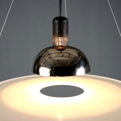 'Frisbi 850' lamp by,Achille Castiglioni,Achille Castiglioni (1918–2002) was the only Italian architect and designer to whom the MoMA in New York has dedicated a retrospective so far. He completed his studies at the Politecnico di Milano in 1944. A 360-degree designer he was involved in urban planning, architecture, exhibitions, and product design.nIn 1956, he co-founded the Associazione per il Disegno Industriale (ADI – Association for Industrial Design).nBetween 1952 and 1953, he worked on the reconstruction of the Palazzo della Permanente in Milan. From 1955 to 1979, he won seven Compasso d'Oro awards, the last one for the Parentesi lamp designed with Pio Manzù. He was also awarded multiple times at the Triennale: Bronze Medal in 1947, Grand Prize in 1951 and 1954, Silver and Gold Medals in 1957, Gold in 1960, and Silver again in 1963.nIn 1971, he began teaching at the Faculty of Architecture at the Polytechnic of Turin.nHis signature, often alongside that of his brother Pier Giacomo, can be found on countless modernists creations produced for many brands including Kartell, Zanotta, Flos, Bernini, Siemens, Knoll, Poggi, Lancia, Alessi, Ideal Standard, and Arflex.n,Achille Castiglioni,Achille Castiglioni,Achille Castiglioni