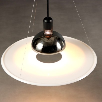 'Frisbi 850' lamp by,Achille Castiglioni,Achille Castiglioni (1918–2002) was the only Italian architect and designer to whom the MoMA in New York has dedicated a retrospective so far. He completed his studies at the Politecnico di Milano in 1944. A 360-degree designer he was involved in urban planning, architecture, exhibitions, and product design.nIn 1956, he co-founded the Associazione per il Disegno Industriale (ADI – Association for Industrial Design).nBetween 1952 and 1953, he worked on the reconstruction of the Palazzo della Permanente in Milan. From 1955 to 1979, he won seven Compasso d'Oro awards, the last one for the Parentesi lamp designed with Pio Manzù. He was also awarded multiple times at the Triennale: Bronze Medal in 1947, Grand Prize in 1951 and 1954, Silver and Gold Medals in 1957, Gold in 1960, and Silver again in 1963.nIn 1971, he began teaching at the Faculty of Architecture at the Polytechnic of Turin.nHis signature, often alongside that of his brother Pier Giacomo, can be found on countless modernists creations produced for many brands including Kartell, Zanotta, Flos, Bernini, Siemens, Knoll, Poggi, Lancia, Alessi, Ideal Standard, and Arflex.n,Achille Castiglioni,Achille Castiglioni,Achille Castiglioni