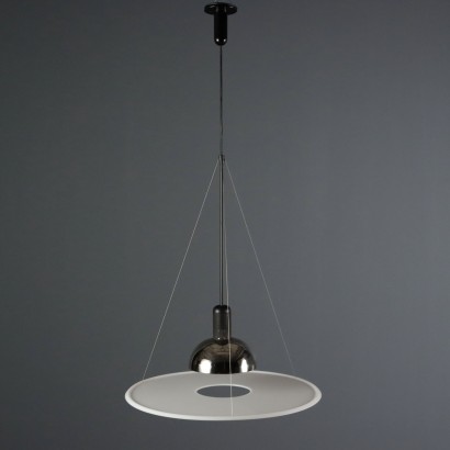'Frisbi 850' lamp by,Achille Castiglioni,Achille Castiglioni (1918–2002) was the only Italian architect and designer to whom the MoMA in New York has dedicated a retrospective so far. He completed his studies at the Politecnico di Milano in 1944. A 360-degree designer he was involved in urban planning, architecture, exhibitions, and product design.nIn 1956, he co-founded the Associazione per il Disegno Industriale (ADI – Association for Industrial Design).nBetween 1952 and 1953, he worked on the reconstruction of the Palazzo della Permanente in Milan. From 1955 to 1979, he won seven Compasso d'Oro awards, the last one for the Parentesi lamp designed with Pio Manzù. He was also awarded multiple times at the Triennale: Bronze Medal in 1947, Grand Prize in 1951 and 1954, Silver and Gold Medals in 1957, Gold in 1960, and Silver again in 1963.nIn 1971, he began teaching at the Faculty of Architecture at the Polytechnic of Turin.nHis signature, often alongside that of his brother Pier Giacomo, can be found on countless modernists creations produced for many brands including Kartell, Zanotta, Flos, Bernini, Siemens, Knoll, Poggi, Lancia, Alessi, Ideal Standard, and Arflex.n,Achille Castiglioni,Achille Castiglioni,Achille Castiglioni