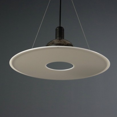'Frisbi 850' lamp by,Achille Castiglioni,Achille Castiglioni (1918–2002) was the only Italian architect and designer to whom the MoMA in New York has dedicated a retrospective so far. He completed his studies at the Politecnico di Milano in 1944. A 360-degree designer he was involved in urban planning, architecture, exhibitions, and product design.nIn 1956, he co-founded the Associazione per il Disegno Industriale (ADI – Association for Industrial Design).nBetween 1952 and 1953, he worked on the reconstruction of the Palazzo della Permanente in Milan. From 1955 to 1979, he won seven Compasso d'Oro awards, the last one for the Parentesi lamp designed with Pio Manzù. He was also awarded multiple times at the Triennale: Bronze Medal in 1947, Grand Prize in 1951 and 1954, Silver and Gold Medals in 1957, Gold in 1960, and Silver again in 1963.nIn 1971, he began teaching at the Faculty of Architecture at the Polytechnic of Turin.nHis signature, often alongside that of his brother Pier Giacomo, can be found on countless modernists creations produced for many brands including Kartell, Zanotta, Flos, Bernini, Siemens, Knoll, Poggi, Lancia, Alessi, Ideal Standard, and Arflex.n,Achille Castiglioni,Achille Castiglioni,Achille Castiglioni