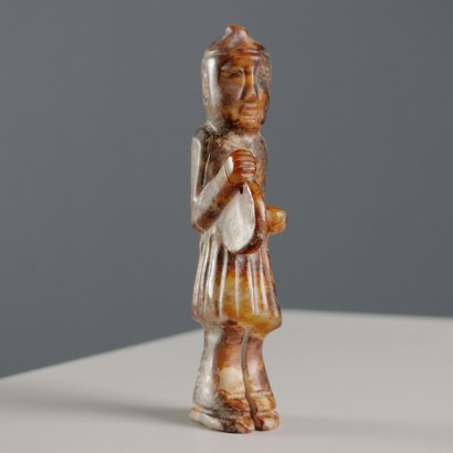 Group of Four Stone Musicians
