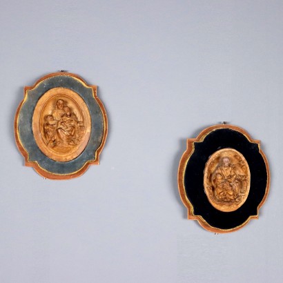Pair of Patinated Plaster Bas-Reliefs