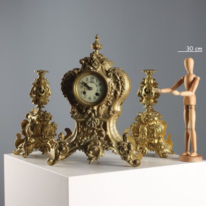 Horloge triptyque en bronze doré