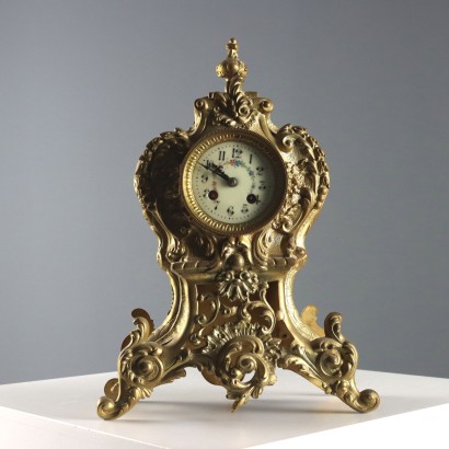 Horloge triptyque en bronze doré