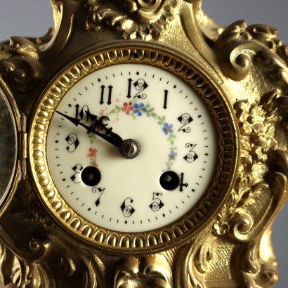 Horloge triptyque en bronze doré