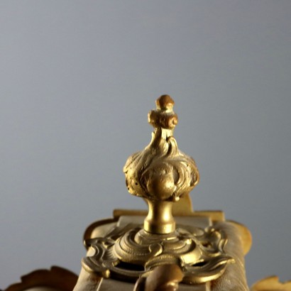 Horloge triptyque en bronze doré