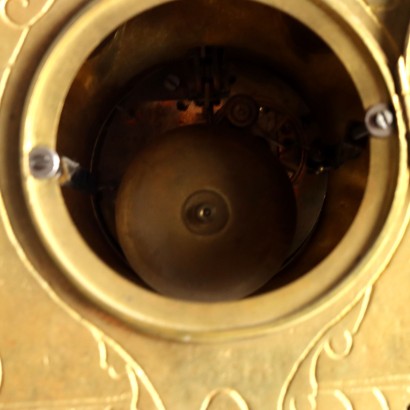 Horloge triptyque en bronze doré