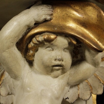 di mano in mano, consolle, coppia di consolle, piccole consolle, consolle con putti, putti alati, consolle putti alati, consolle antiche, consolle antiquariato, consolle 800, consolle fine 800, consolle primi 900, consolle 900, consolle primi 900, consolle in legno laccato, piano sagomato, consolle intagliate