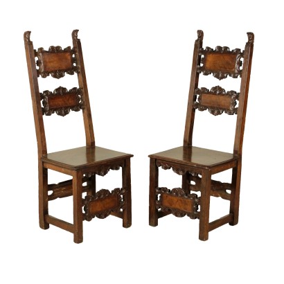 Pair of chairs carved