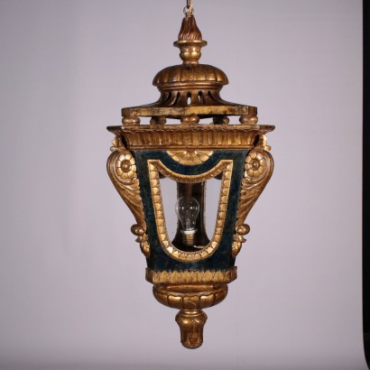 Pair of lanterns in the carved and gilded wood